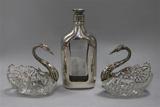 A pair of sterling silver-mounted (925) cut glass swan bon bon dishes and a glass spirit flask